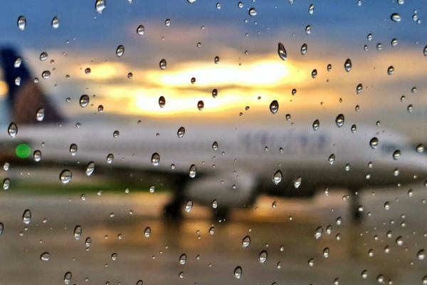 view from window of plane in rain